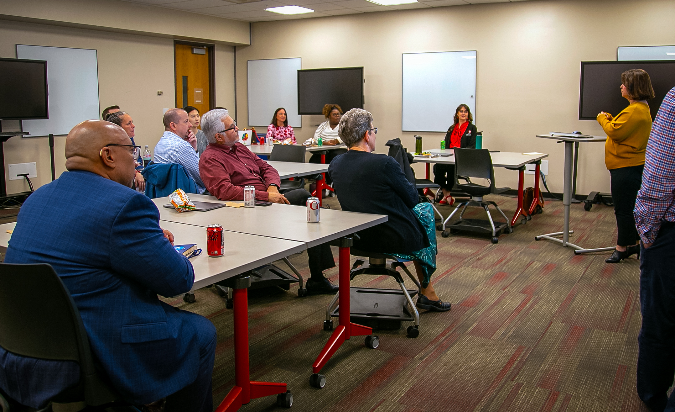 Mosaic Faculty Fellows gathered in a Mosaic Active Learning classroom